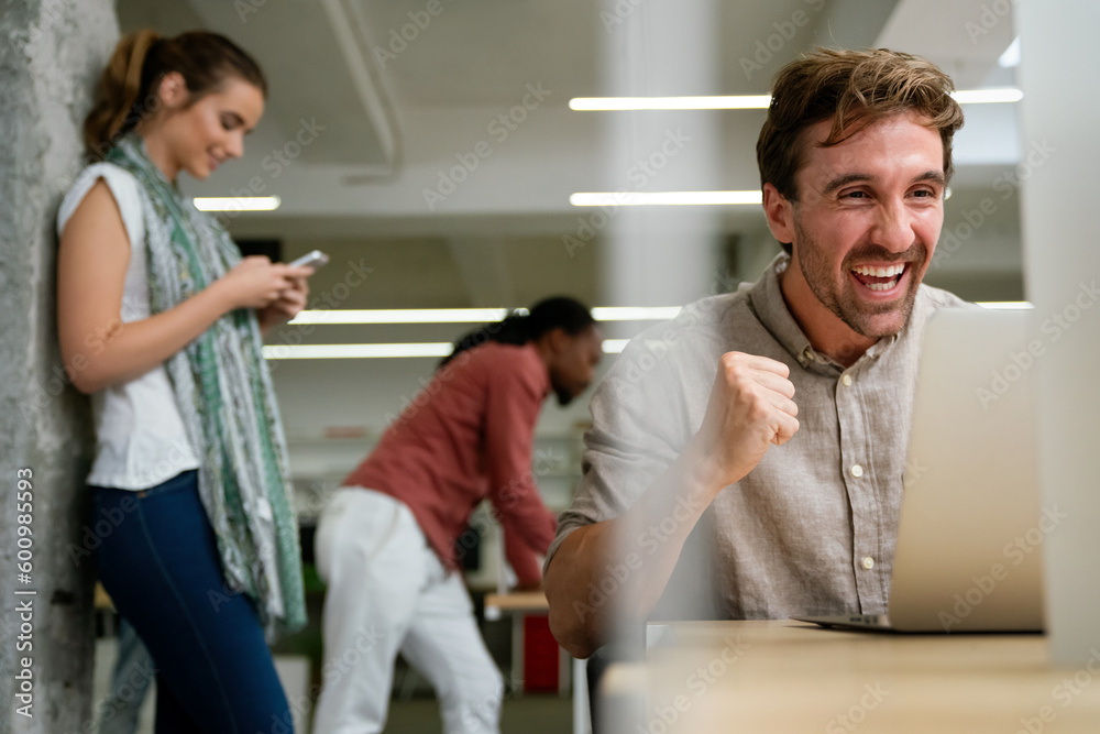 Group of happy startup business people having fun and chatting at workplace office