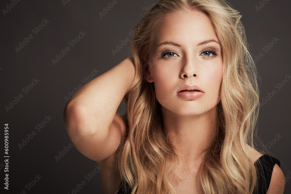 Makeup, beautiful and portrait of a woman with confidence isolated on a dark background in a studio. Young, confident and the face of a cosmetics model looking gorgeous with a facial cosmetic look Makeup, beautiful and portrait of a woman with confidence isolated on a dark background in a studio. Young, confident and the face of a cosmetics model looking gorgeous with a facial cosmetic look