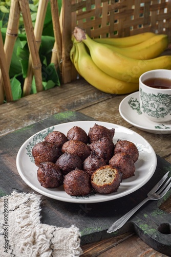 Malaysian fritter snack deep fried banana balls or Malay as Cekodok Pisang photo