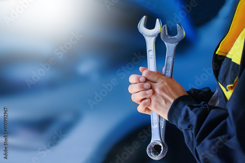 Wallpaper Mural Auto Repair Shop. Auto mechanic working on car broken engine in mechanics service or garage. Transport maintenance wrench detial Wide banner or panorama photo. Torontodigital.ca