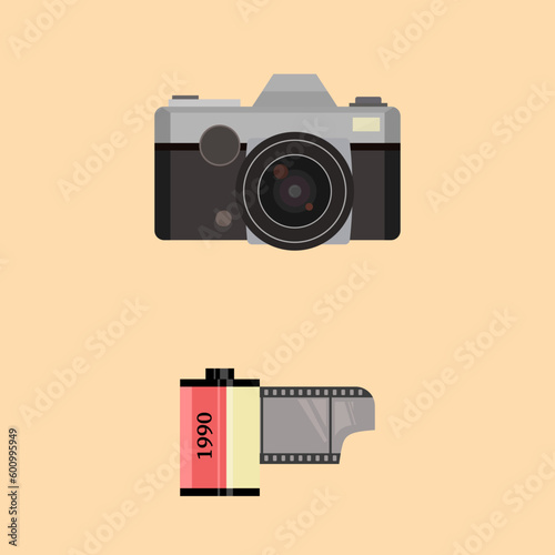 Nostalgia 90s photo camera and film roll.