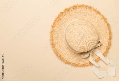 Straw hat on сolor background, top view