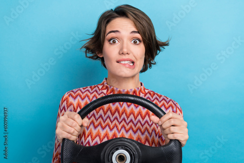 Photo of doubtful uncertain woman dressed pink shirt biting lips stack traffic jam isolated blue color background