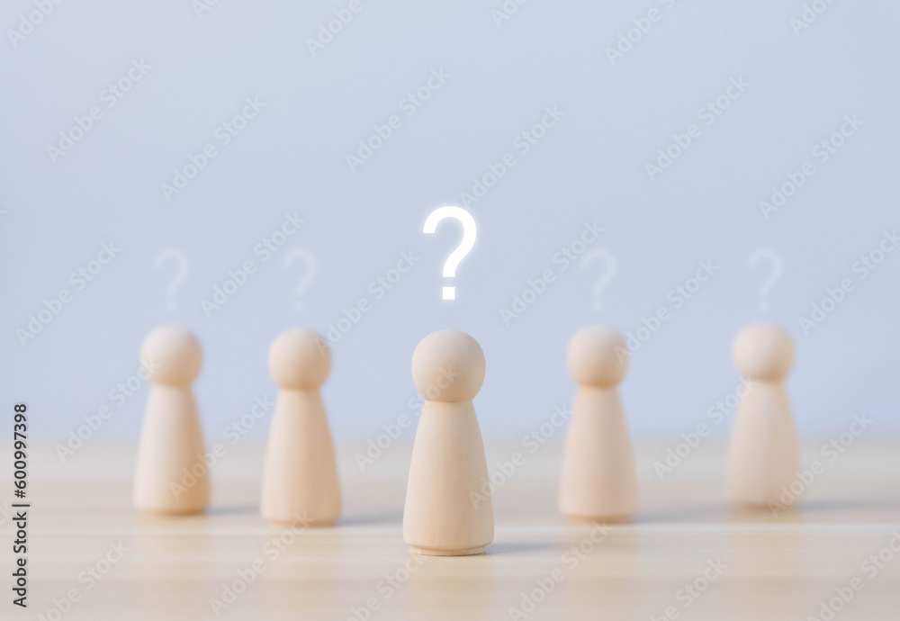 wooden block people show a question mark icon.
wooden block people show a question mark icon.
