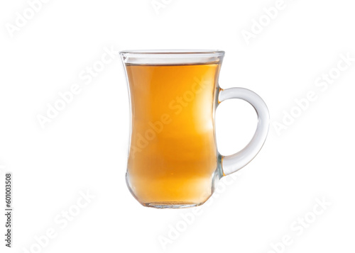 Amber color tea in a transparent glass cup. Cup isolated on a white background.