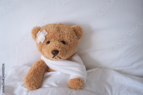 bear with bandage, child medical care . injured child teddy bear and painful in hospital, fell ill in the bed, accident, insurance, health care, risk, loss, emergency, protection, treat, kid , baby.