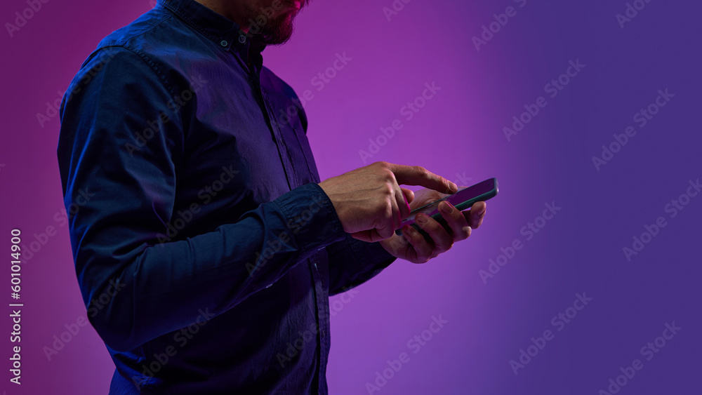 Fototapeta premium Businessman working with mobile phone, using online services for business. Innovations, impact of global digitalization. Concept of business, modern technologies, network, internet, gadgets
