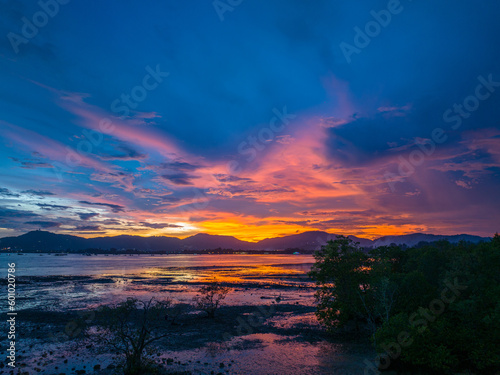 ..aerial view reflection of colorful cloud in bright sky of sunset above the ocean at Khao Khad Phuket. .Majestic sunset or sunrise landscape Amazing light of nature background. © Narong Niemhom