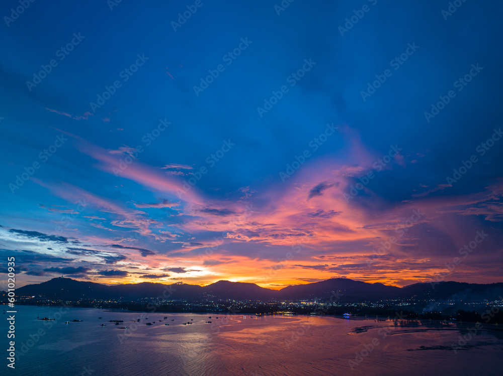 ..aerial view reflection of colorful cloud in bright sky of sunset above the ocean at Khao Khad Phuket. .Majestic sunset or sunrise landscape Amazing light of nature background. ..aerial view reflection of colorful cloud in bright sky of sunset above the ocean at Khao Khad Phuket. .Majestic sunset or sunrise landscape Amazing light of nature background.