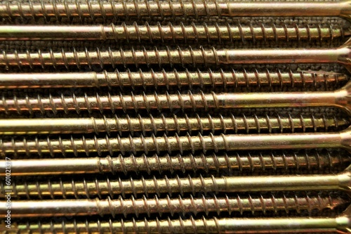 Close-up of long screws. Screws for the construction of wooden structures.