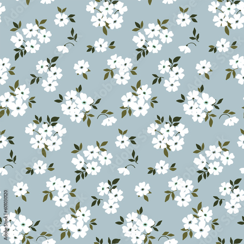 Seamless floral pattern, liberty ditsy print with rustic motif. Romantic botanical design for fabric, paper: hand drawn plants, small white flowers, tiny leaves on blue background. Vector illustration
