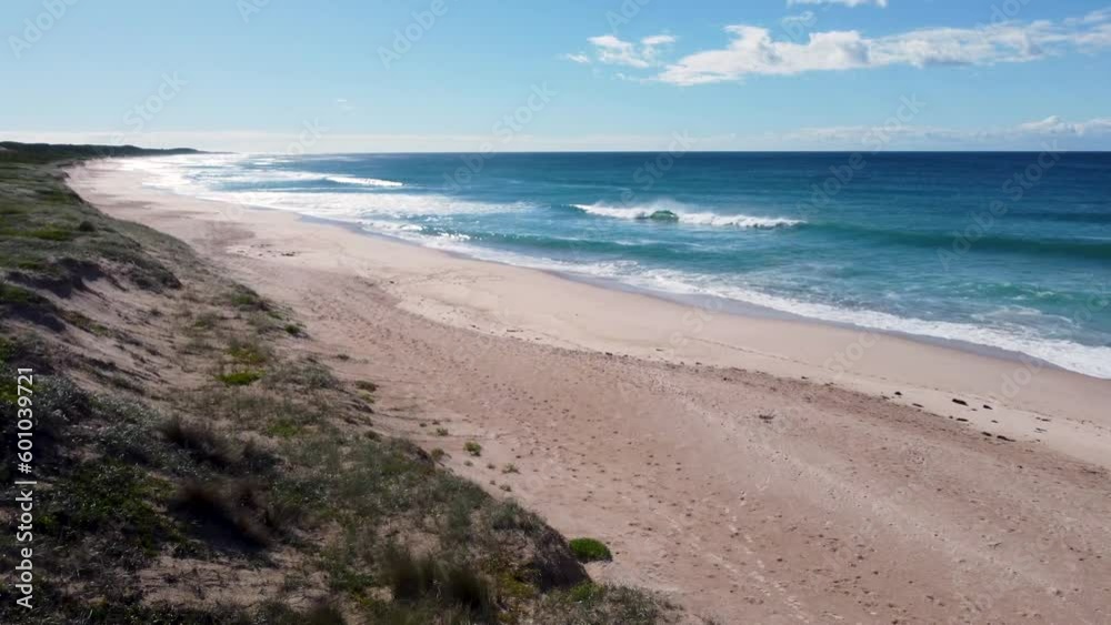 Aerial drone shot off the Entrance Magenta of Pacific Ocean Sand regeneration reef sand dunes sky travel tourism surf beach Central Coast NSW Australia 4K Aerial drone shot off the Entrance Magenta of Pacific Ocean Sand regeneration reef sand dunes sky travel tourism surf beach Central Coast NSW Australia 4K