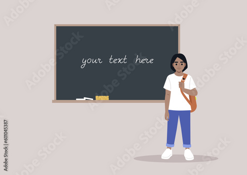 A full body portrait of a school kid carrying a backpack on one strap, a chalkboard with a copy space on the background