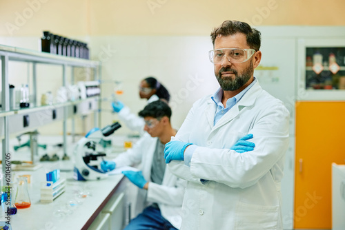 Portrait of confident scientist in laboratory looking at camera.