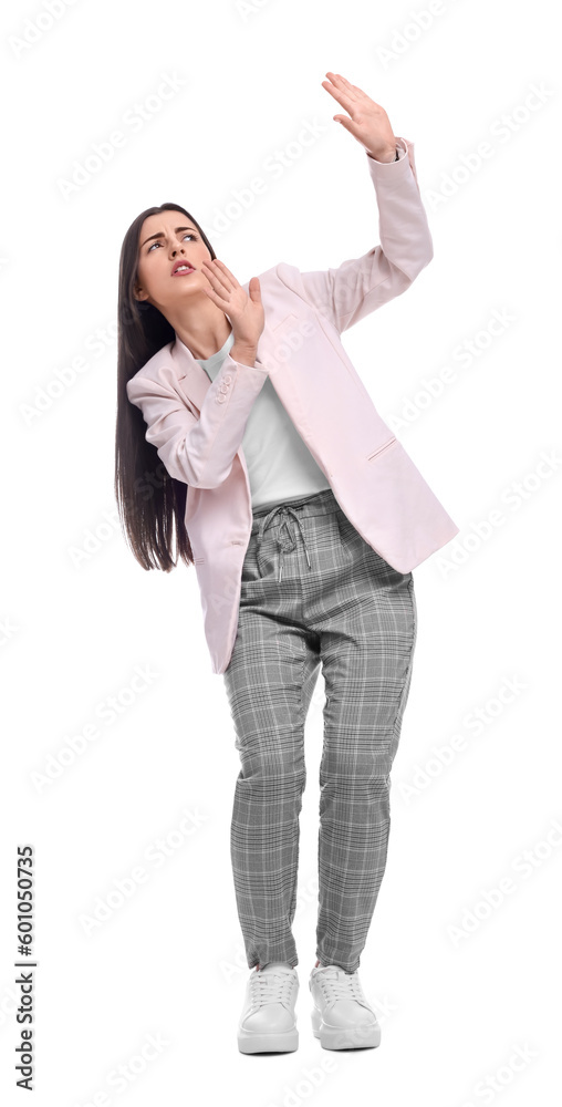 Beautiful businesswoman in suit avoiding something on white background Beautiful businesswoman in suit avoiding something on white background