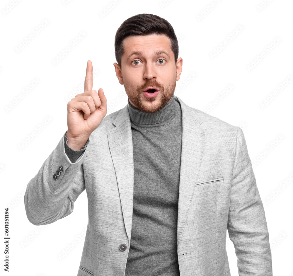 Handsome bearded businessman in suit pointing at something on white background Handsome bearded businessman in suit pointing at something on white background
