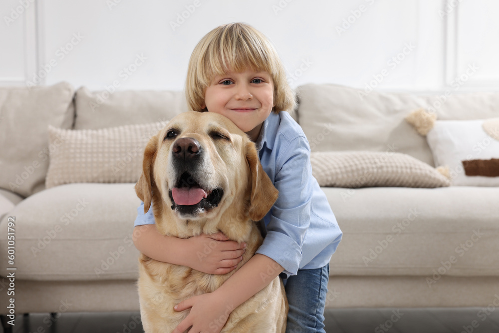 Cute little child with Golden Retriever at home. Adorable pet Cute little child with Golden Retriever at home. Adorable pet