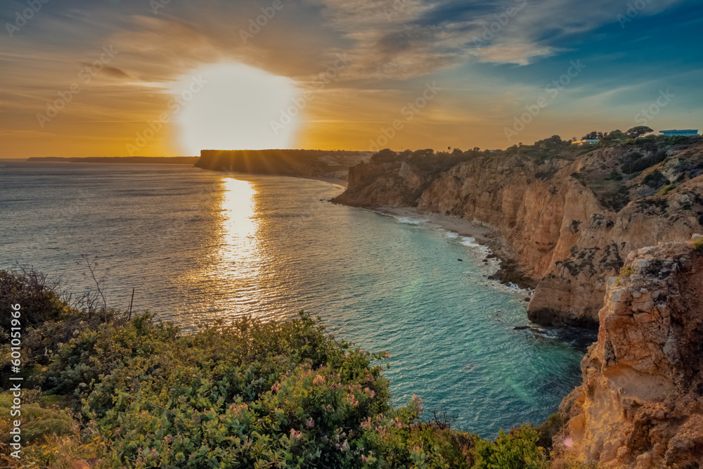 Ponta da Piedade (point of mercy) a headland with dramatic yellow-golden cliff-like rock formations, arches and grottos along the coastline of the town of Lagos, Algarve, Portugal