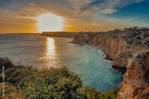 Ponta da Piedade (point of mercy) a headland with dramatic yellow-golden cliff-like rock formations, arches and grottos along the coastline of the town of Lagos, Algarve, Portugal