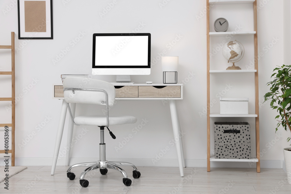 Workplace with comfortable office chair indoors. Interior design