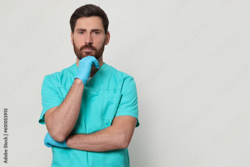 Nurse in medical uniform on white background, space for text Nurse in medical uniform on white background, space for text