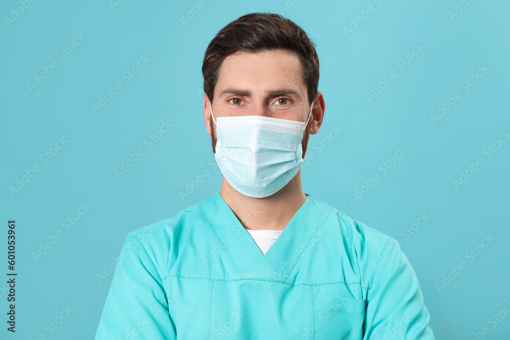 Nurse with medical mask on light blue background Nurse with medical mask on light blue background