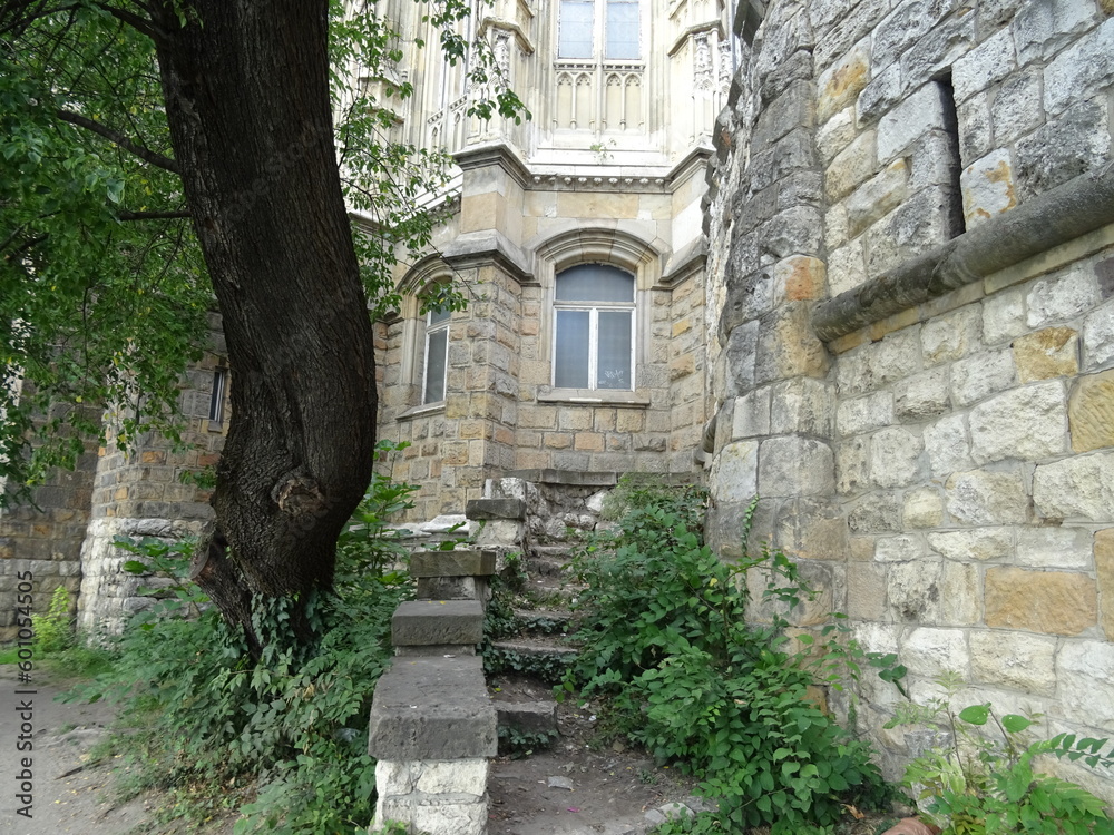 Fototapeta premium Old stone wall and a staircase