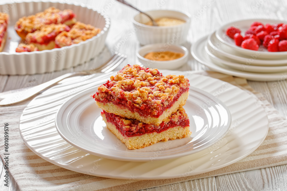 Raspberry Crumble Bars on white plate, top view Raspberry Crumble Bars on white plate, top view