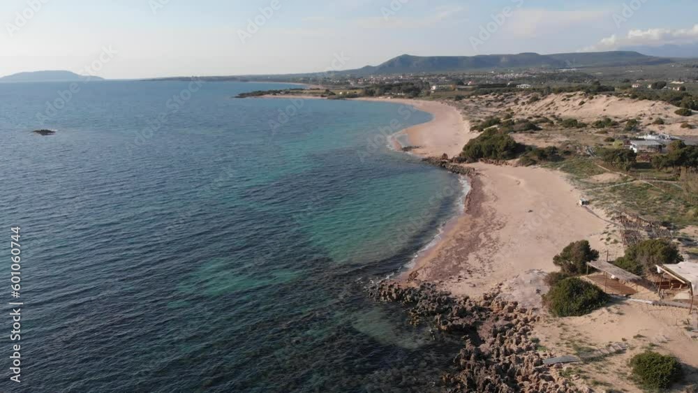 Aerial beautiful beach and water bay in the greek spectacular coast line. Turquoise blue transparent water, unique rocky cliffs, Greece summer top travel destination Peloponnese Aerial beautiful beach and water bay in the greek spectacular coast line. Turquoise blue transparent water, unique rocky cliffs, Greece summer top travel destination Peloponnese
