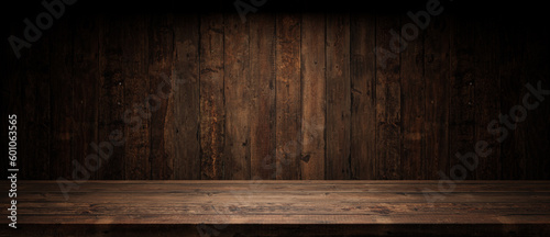 Old planks wall and table with light empty space. Vintage wooden background and spotlight showroom. © SlavoArtist