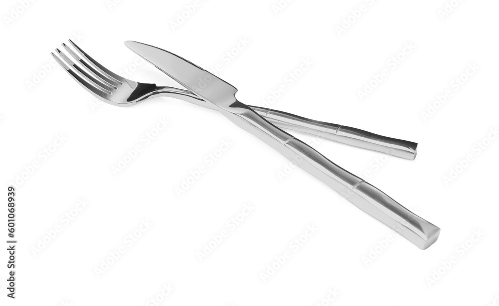 Fork and knife isolated on white. Stylish shiny cutlery set Fork and knife isolated on white. Stylish shiny cutlery set