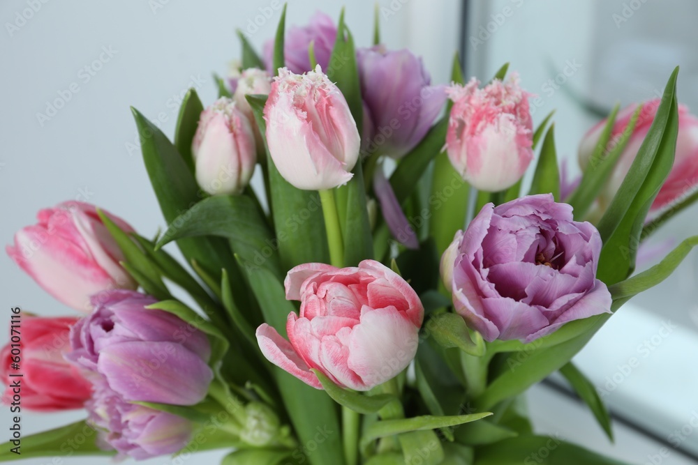 Beautiful bouquet of colorful tulip flowers indoors, closeup
