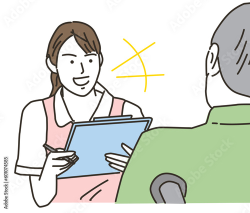 高齢者と話す笑顔の女性介護士
