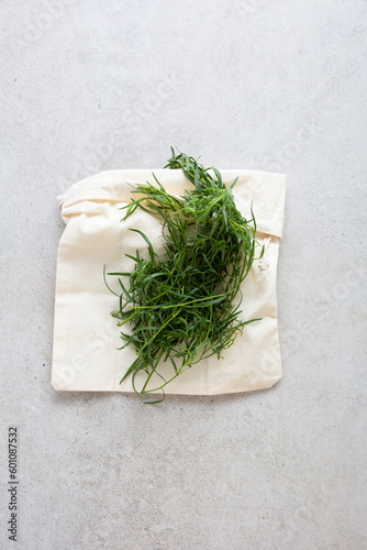 Top view of bunch green tarragon on fabric food estragon