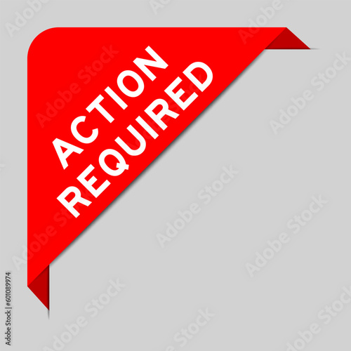 Red color of corner label banner with word action required on gray background