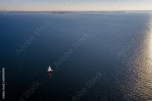 Wallpaper Mural Masurian Lake District in Poland - lonely sailboat on a large lake - drone aerial landscape photography Torontodigital.ca