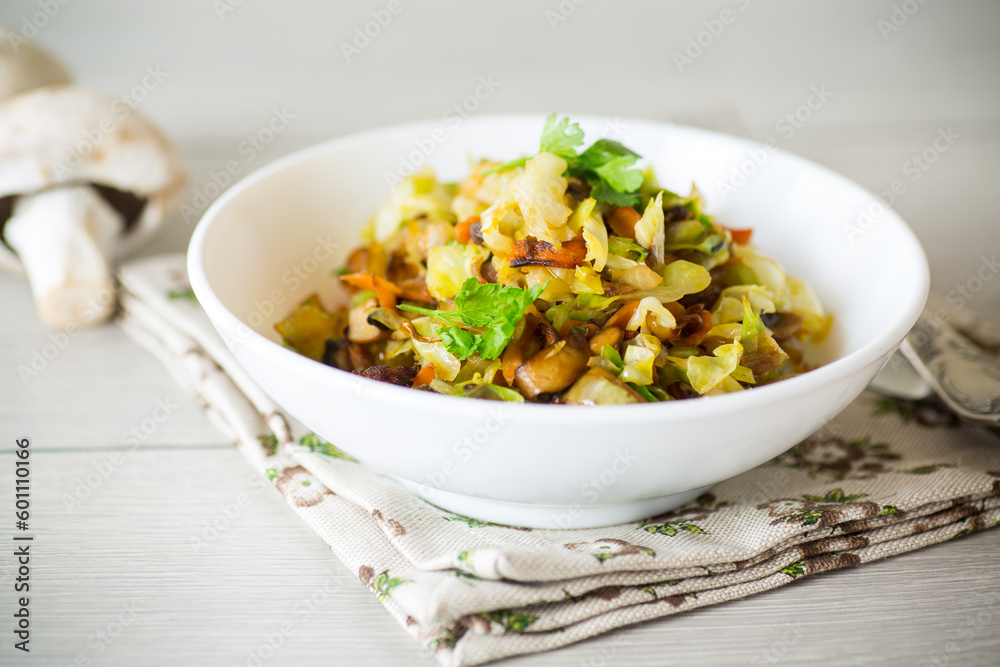 cabbage early fried with mushrooms, carrots and vegetables cabbage early fried with mushrooms, carrots and vegetables