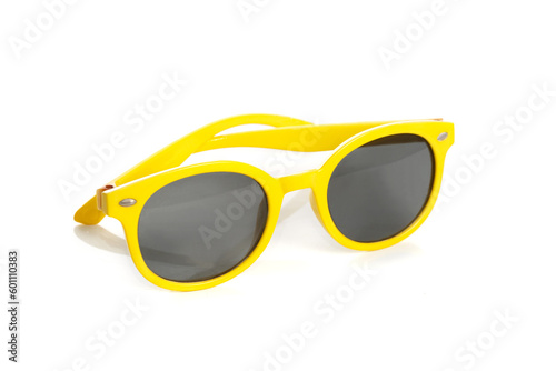 Sunglasses in a yellow plastic frame isolated on a white background.