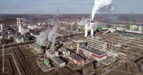 Chemistry Factory in Lithuania, Achema in Jonava City. Clear Blue Sky and Smoke Stacks in Background. Drone