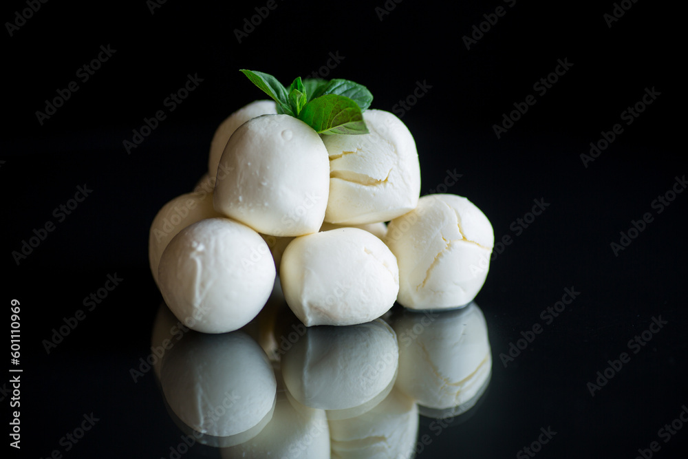 Small balls of traditional mozzarella in a ceramic bowl