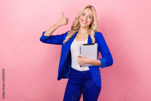 Photo of young business lady blonde curly hair wear blazer pants thumb up recommend new tablet notepad secretary isolated on pink color background