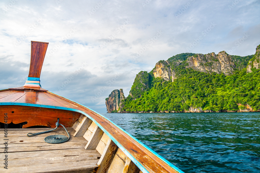 View of limestone rock at Ko Phi Phi islands, Thailand. View from long tailed boat. Exotic and tropic nature, summer paradise.