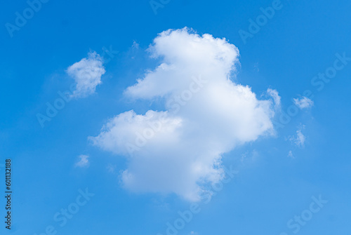Little rabbit cloud  Fluffy white clouds clump together to form a rabbit shape in the blue sky on a clear day.
