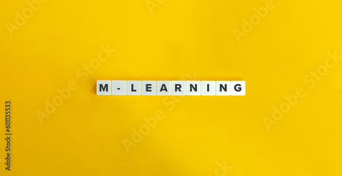 M-learning or Mobile Learning Word and Concept. Block Letter Tiles on Yellow Background. Minimal Aesthetics.