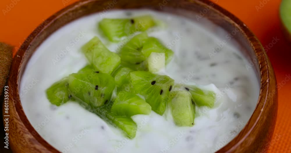 fresh yogurt made from natural ingredients with kiwi, milk fresh yogurt with kiwi flavor and kiwi slices fresh yogurt made from natural ingredients with kiwi, milk fresh yogurt with kiwi flavor and kiwi slices