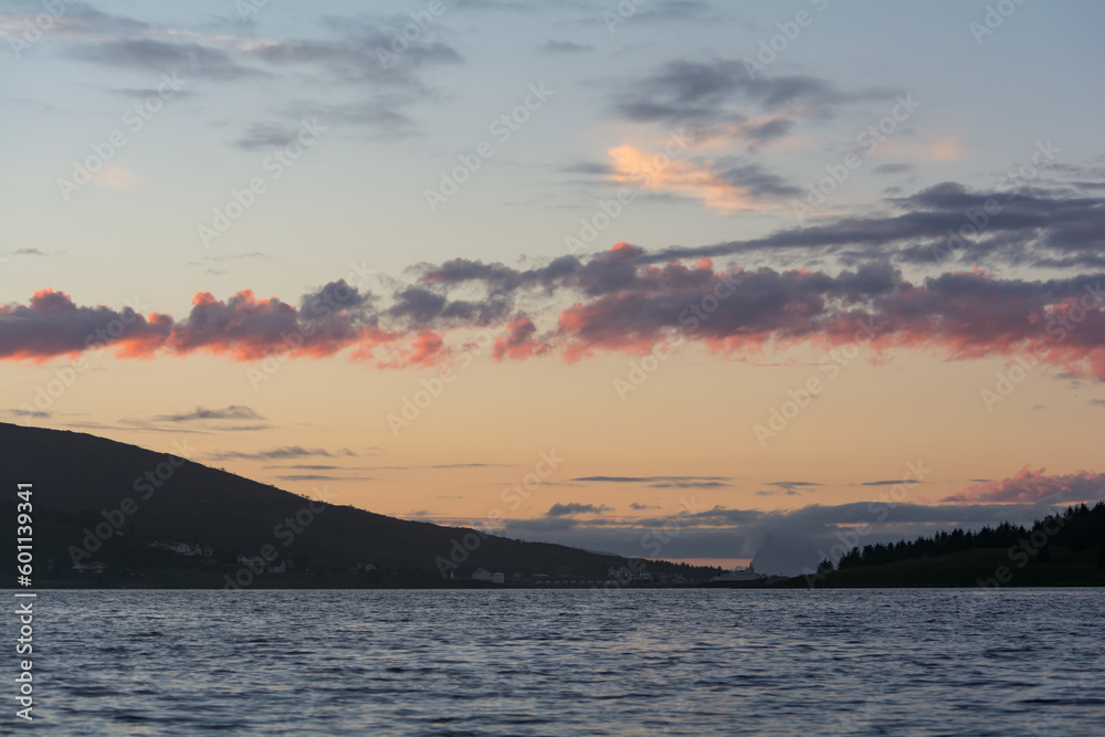 Fototapeta premium Clouds over a fjord in northern Norway