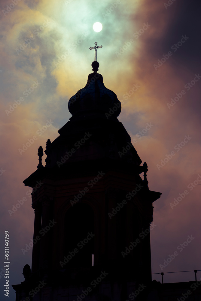 Silhouette of tower of the cathedral of Guatemala, Central America, detail at sunrise in urban area of Latin American city.