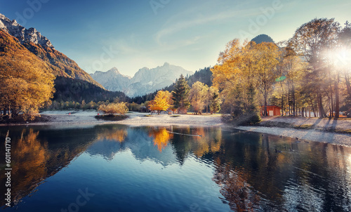 Amazing Mountain landscape, calm lake and mountain range. Breathtaking Scene. Panoramic view of beautiful mountain landscape in Alps. Picture of wild area © jenyateua