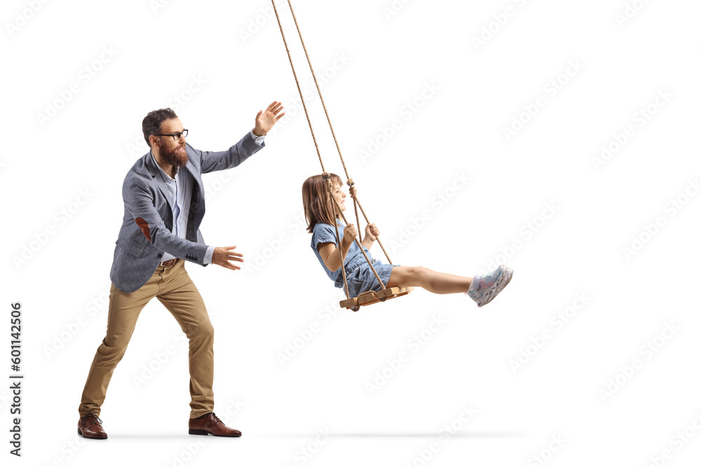 Father pushing a little girl on a swing - obrazy, fototapety, plakaty 