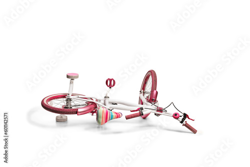 Studio shot of a kids bicycle falling on the ground